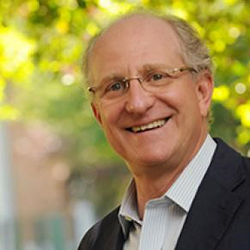 Steven Pearlstein standing outside and smiling