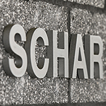 An image of the word SCHAR on a concrete block wall